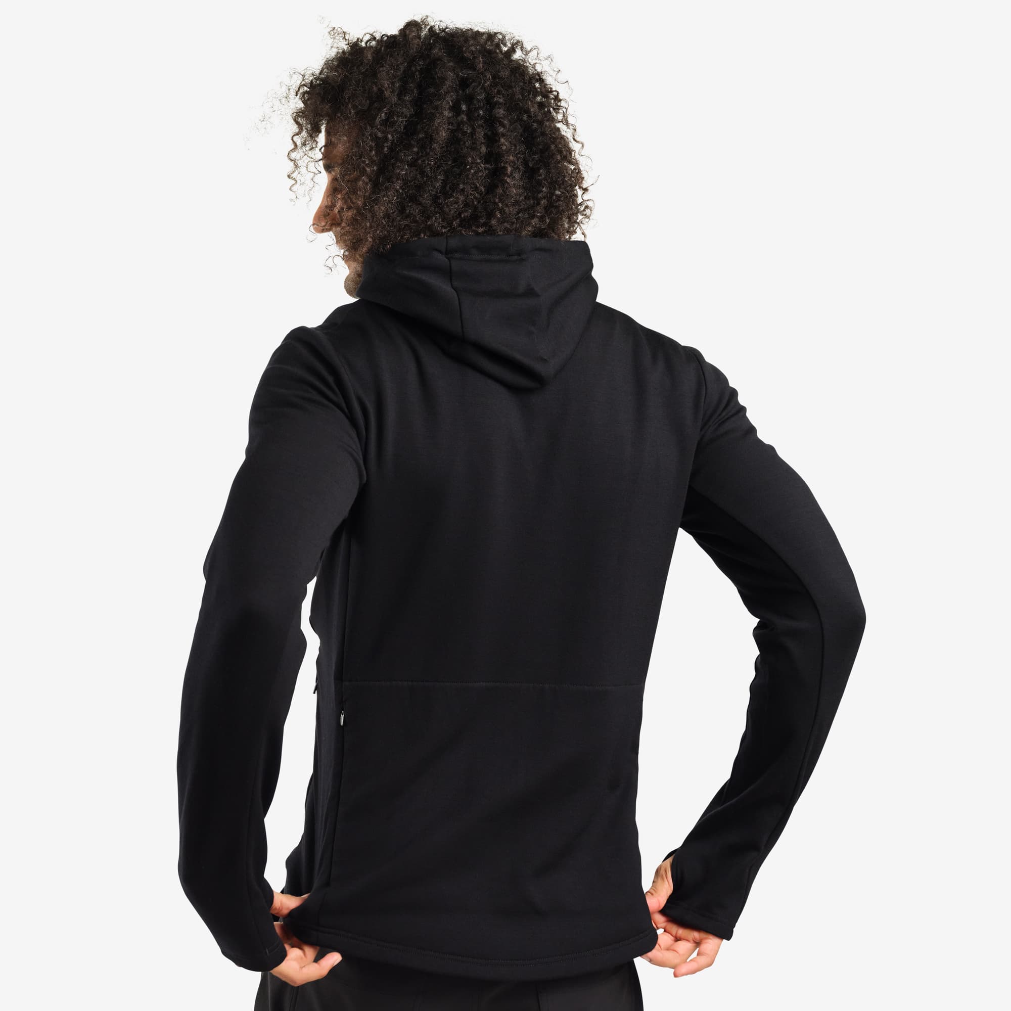 Men's merino blend hoodie in black worn by a man back view #color_black