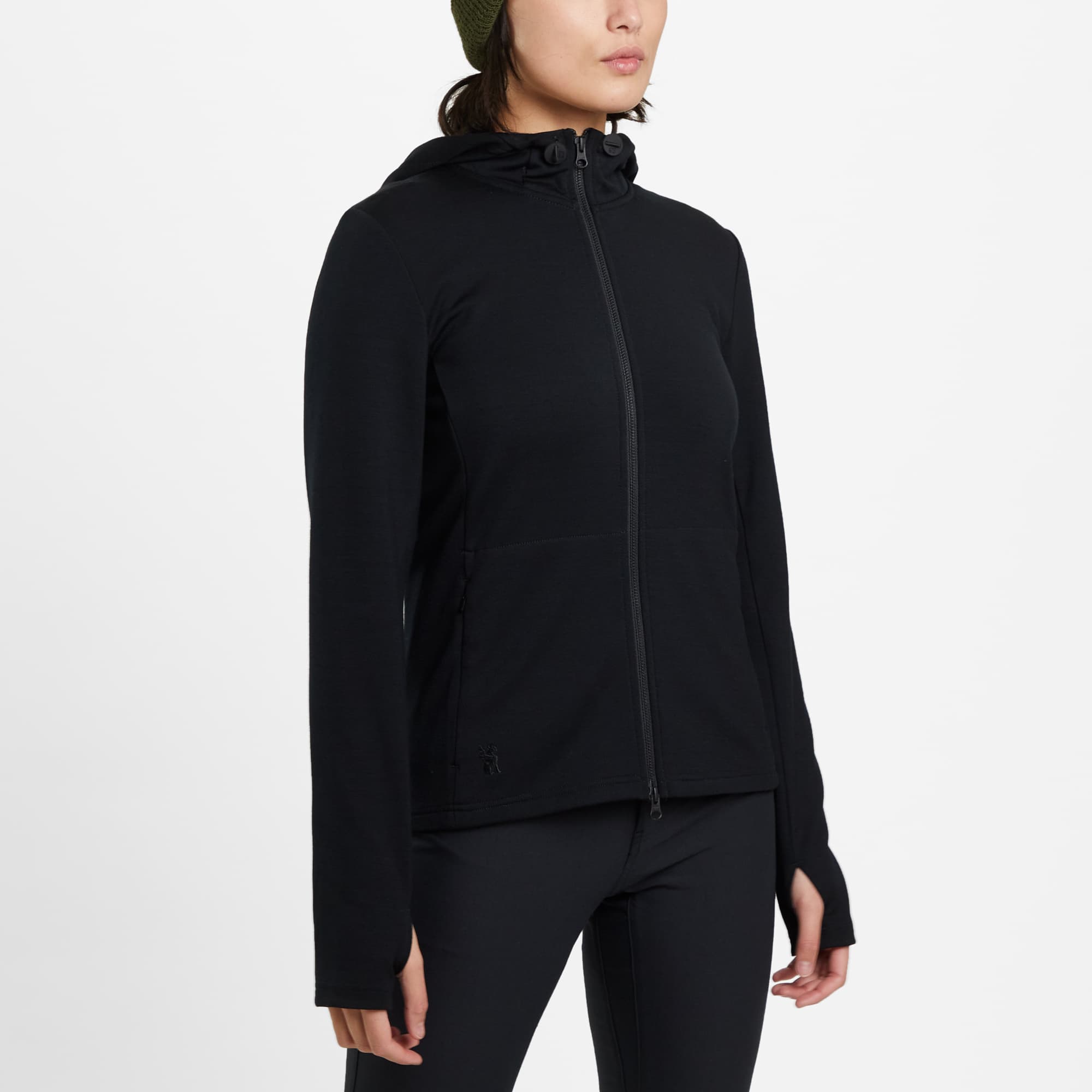 Women's Merino blend performance hoodie in black worn by a woman side view