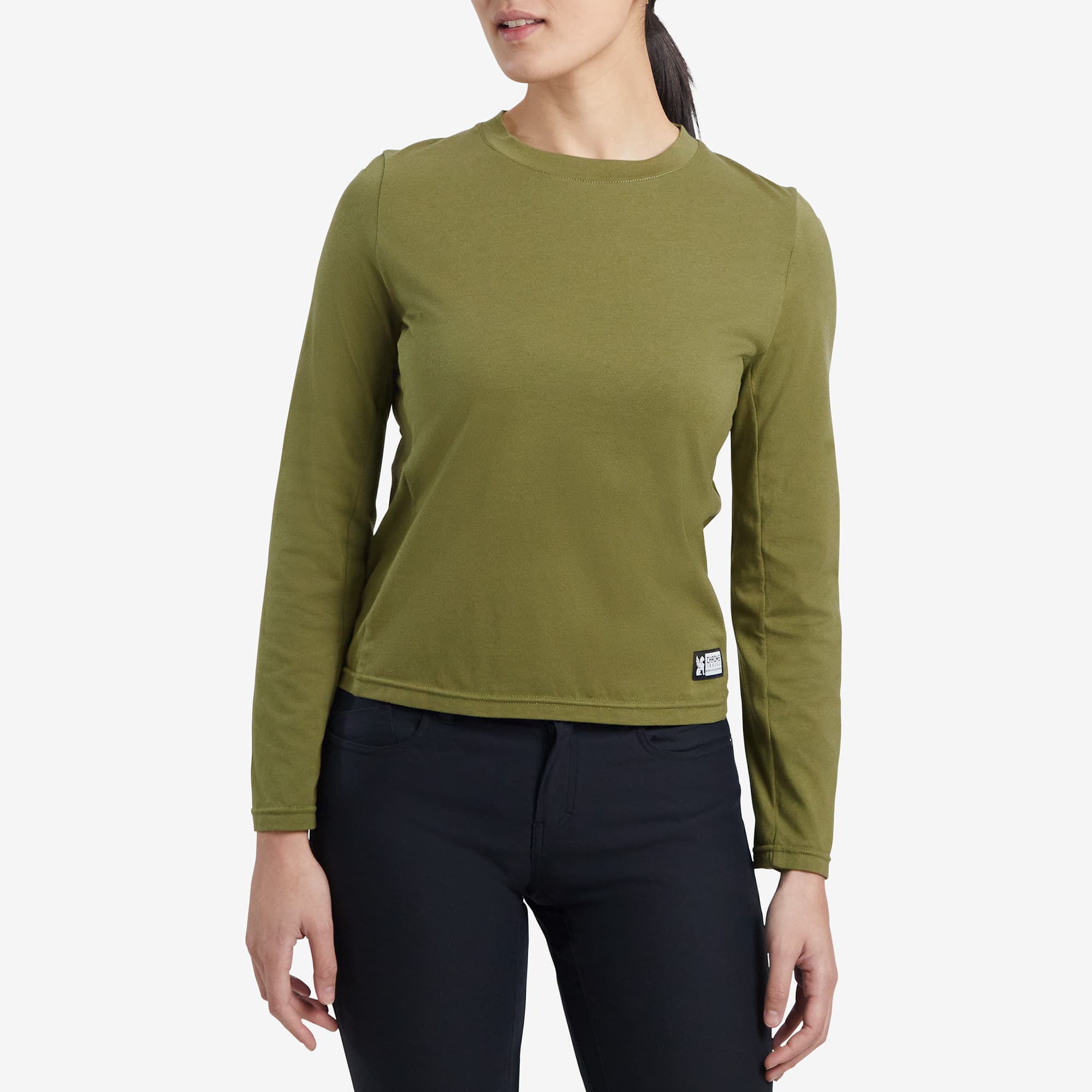 Women's Chrome basics T-Shirt green long sleeve worn by a woman #color_olive branch