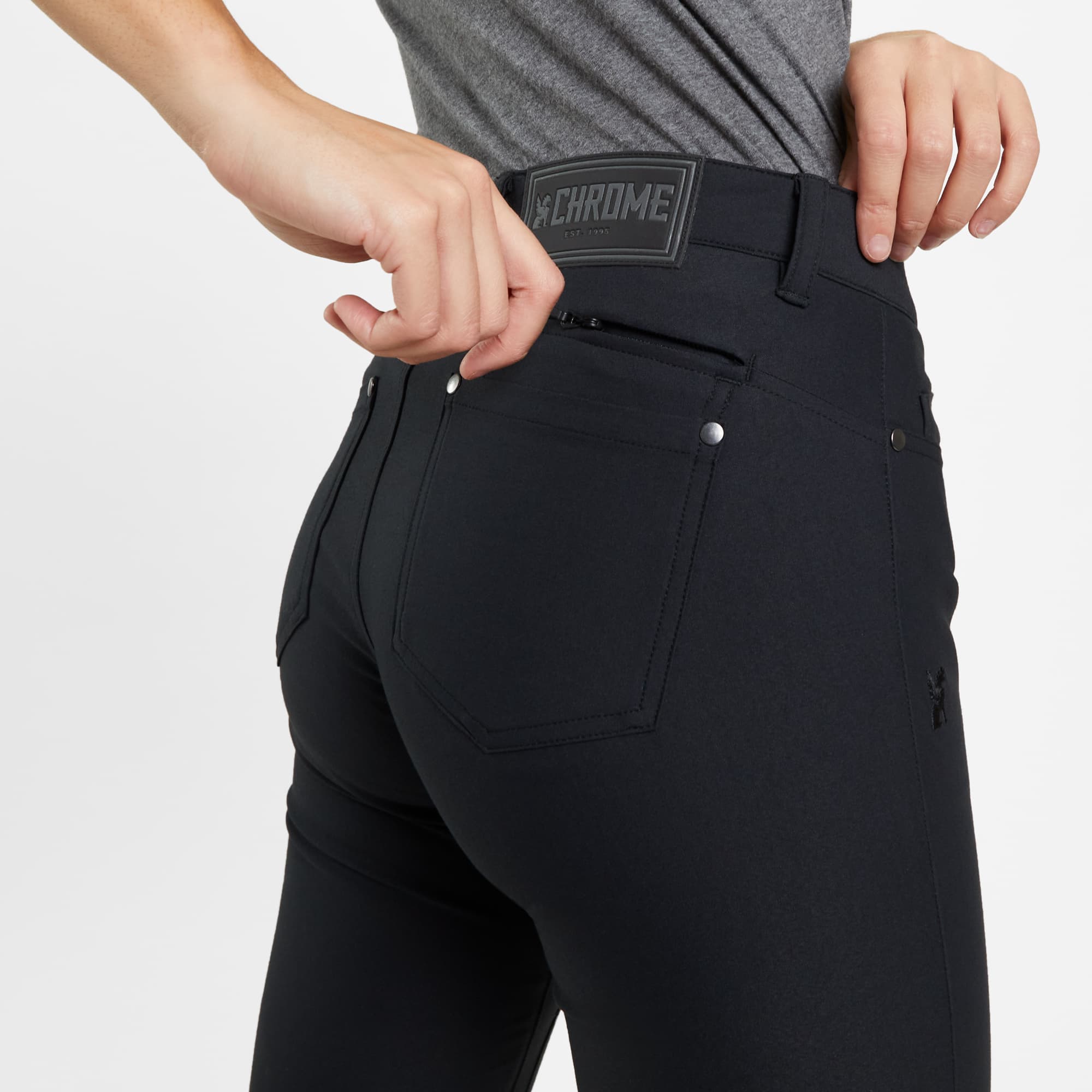 Women's 5 pocket pant in black worn by a woman back detail