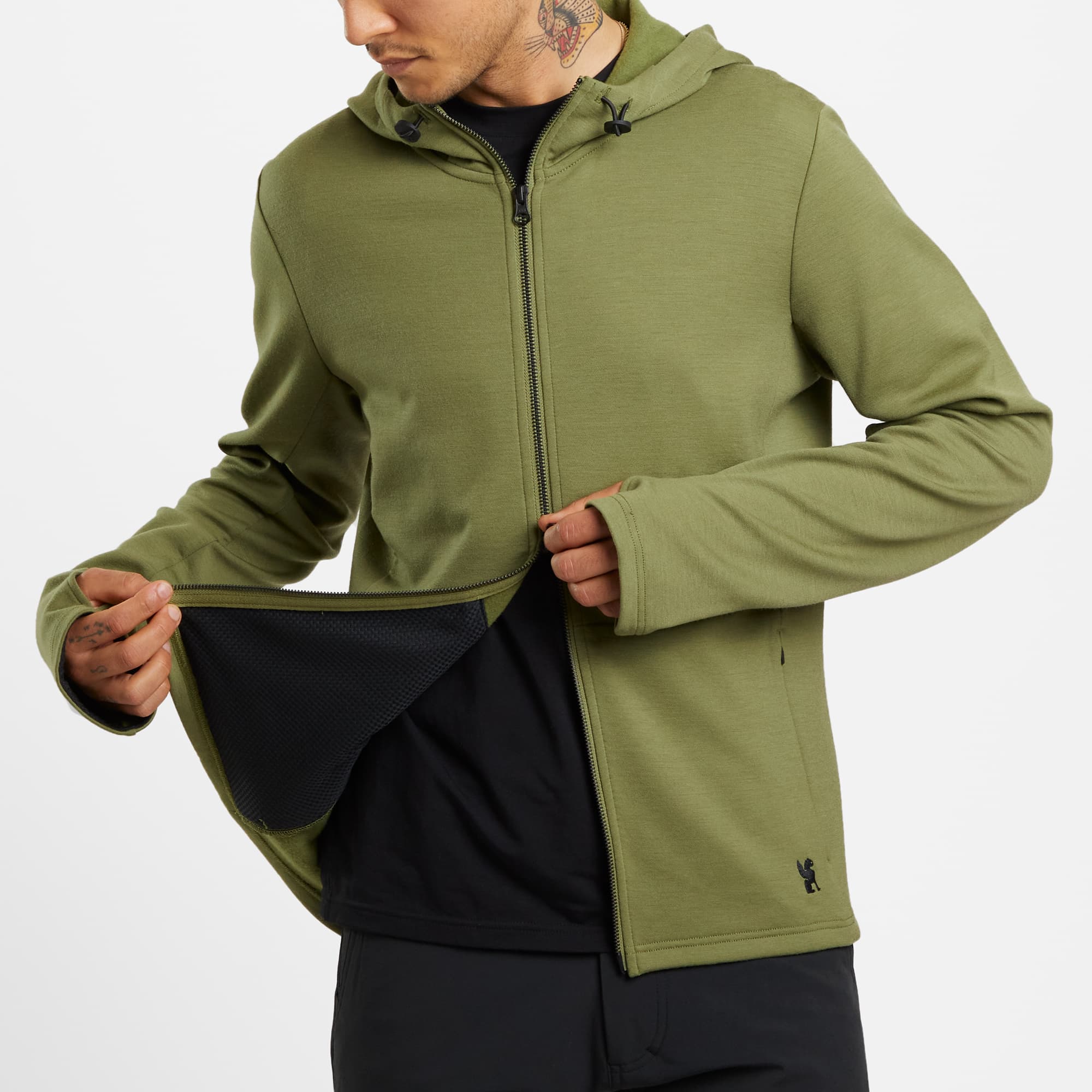 Men's merino blend hoodie in green worn by a man #color_olive branch