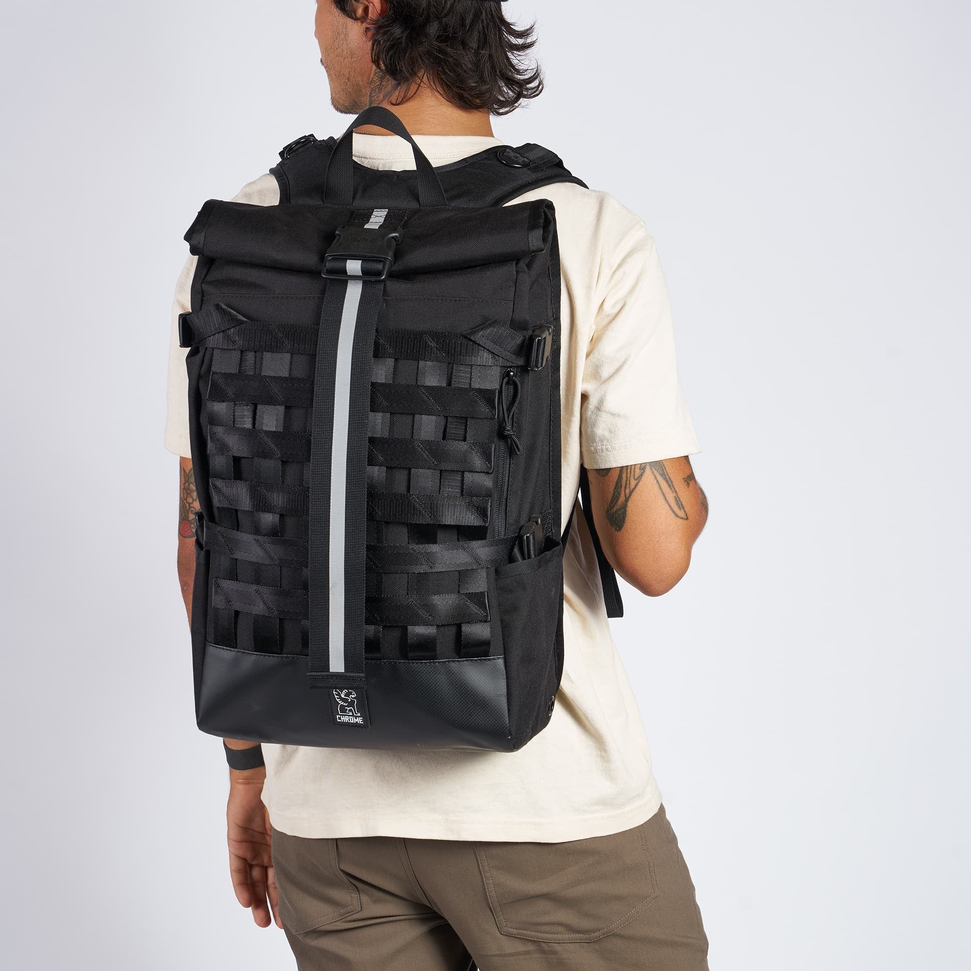 Black Barrage Cargo Backpack on a man