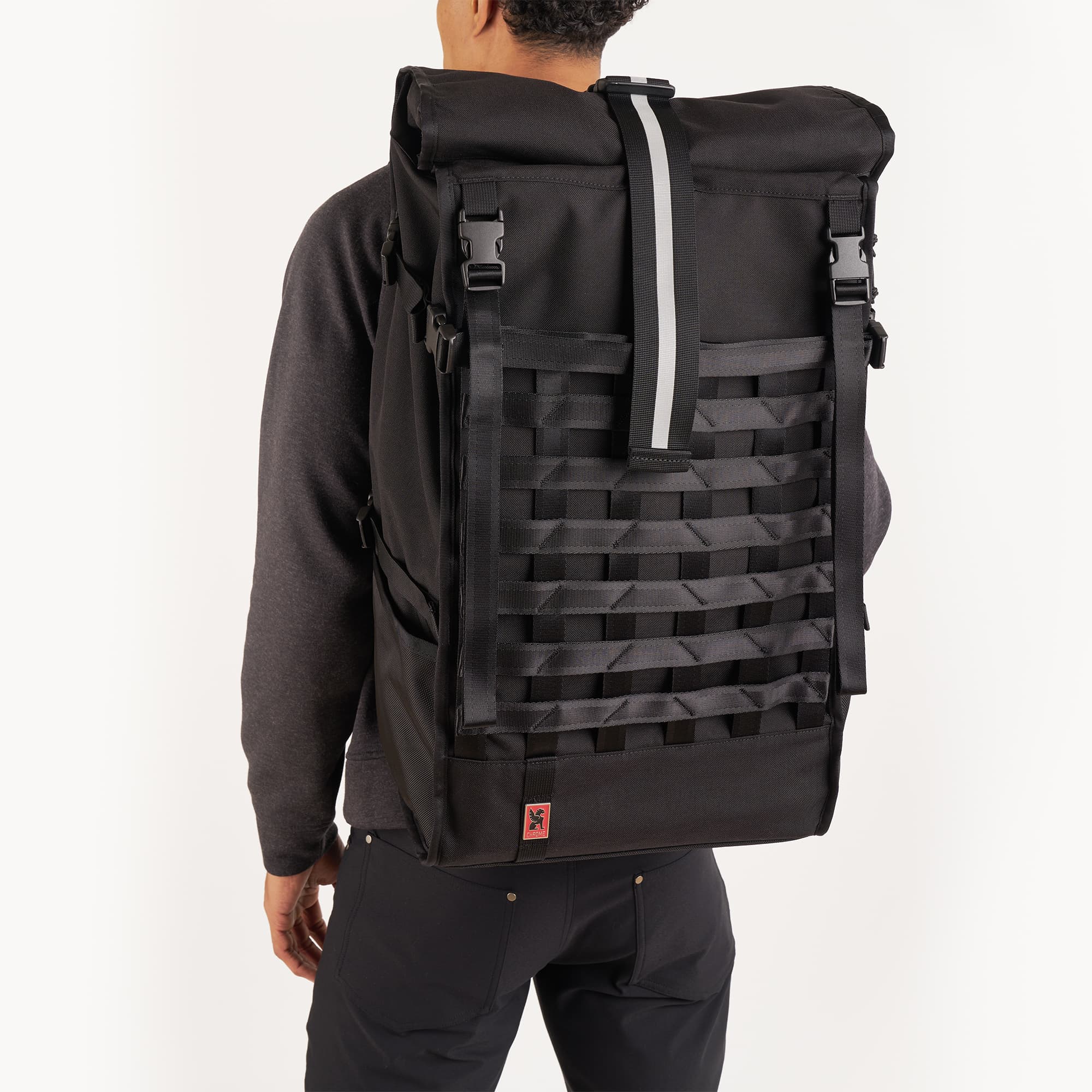Black Barrage Pro backpack on a man back view #color_black/red