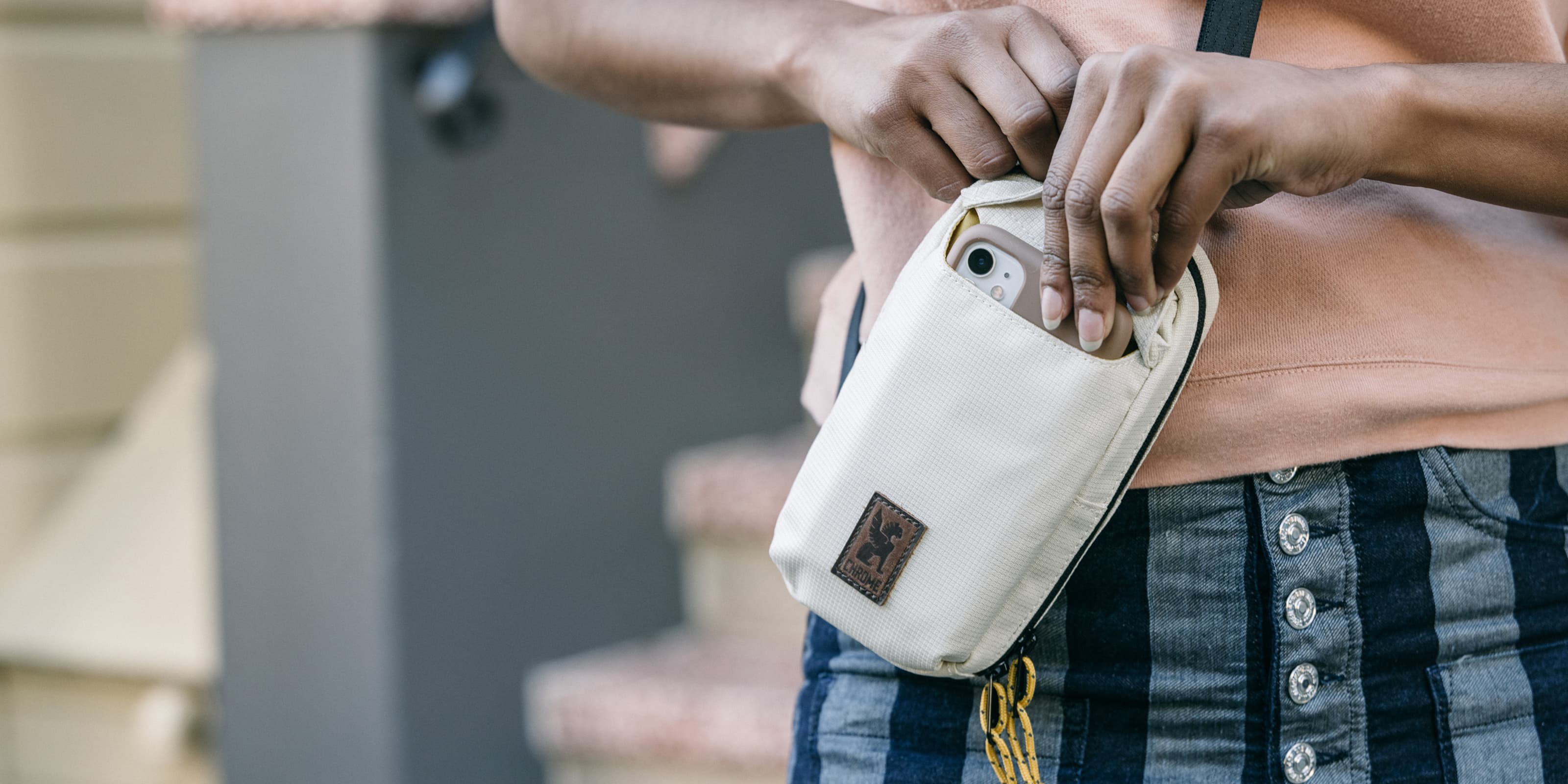 Ruckas Accessory Pouch shown as someone takes out their phone